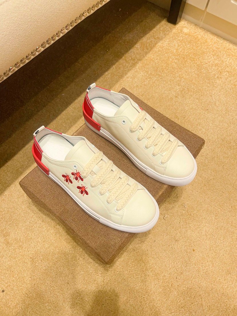White Low-Top Sneakers with Red Floral Accents